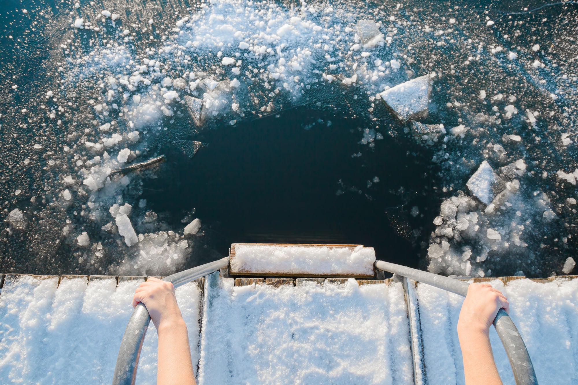 Image of an outdoor ice plunge including platform and ladder