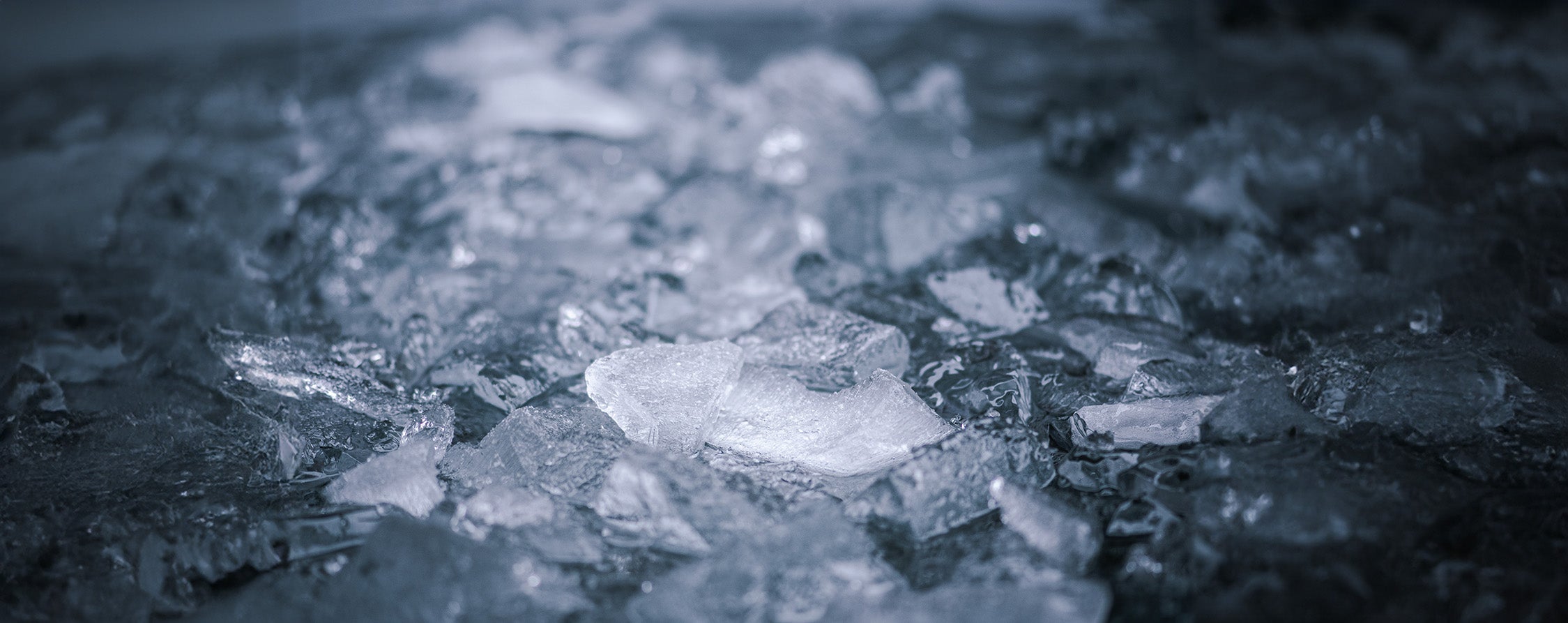 Ice floating on dark water - moody