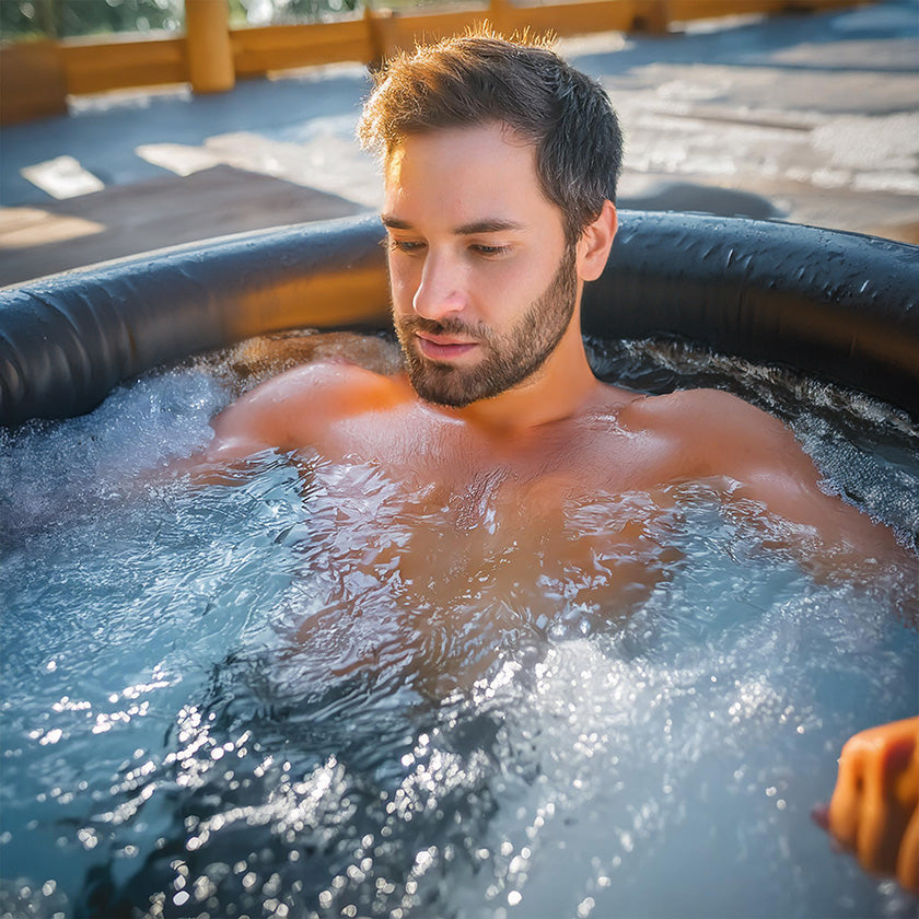 Man sitting in an Ice Bath Tub in the evening sun